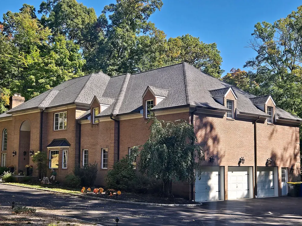 Brick colonial with a new charcoal architectural shingle roof