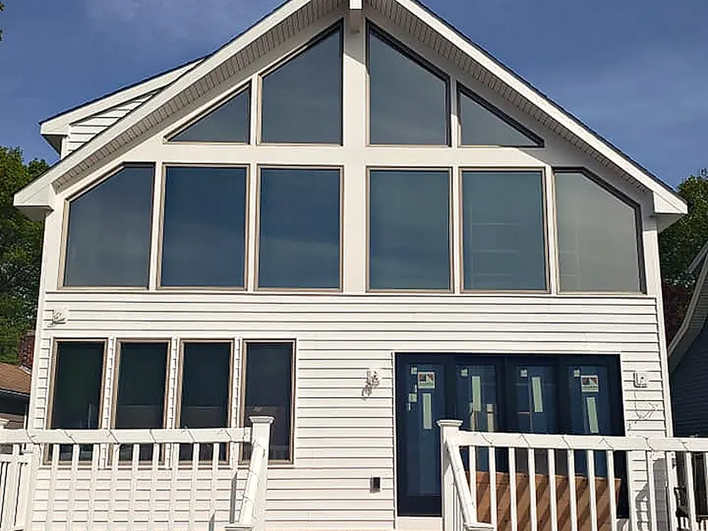 New windows across a tall gable wall installed by RJ Construction